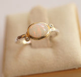 White opal east west ring