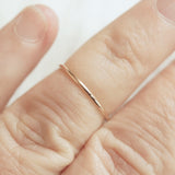 skinny gold ring on an old ladies finger
