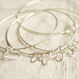 silver bangles for stacking with heart charms