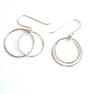 thin silver hoop earrings on French hooks